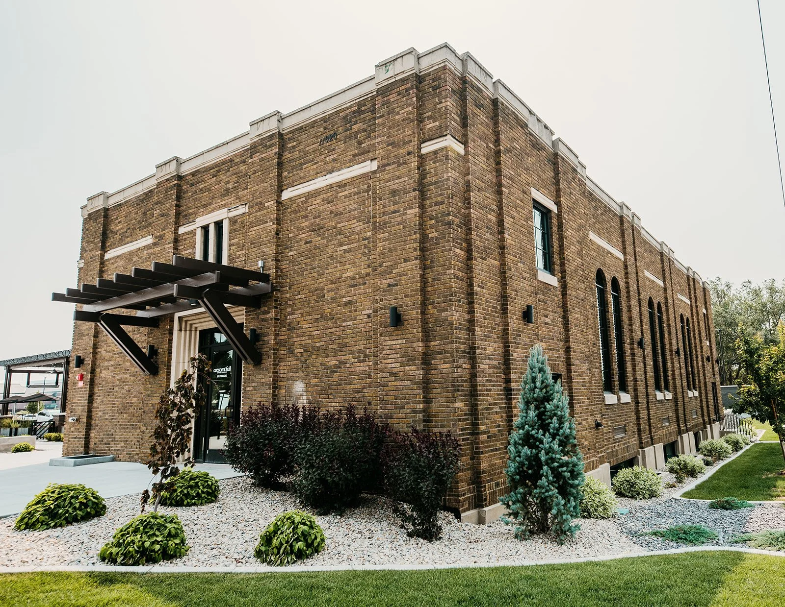 Crescent Hall Event Venue - Historic 1930s schoolhouse with exposed brick and wood floors